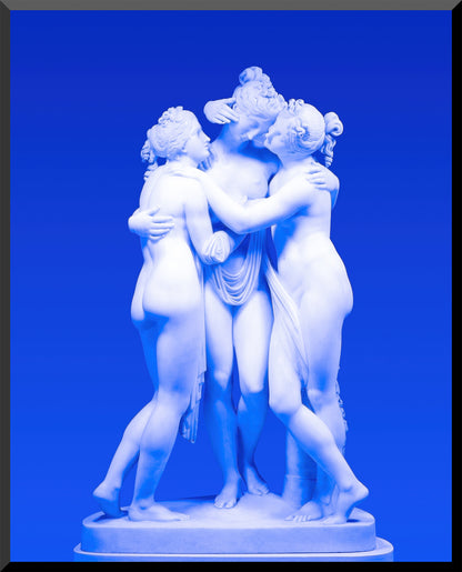 Statue of three figures embracing on a blue background